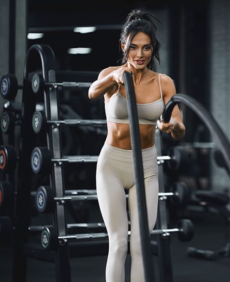 brunette-woman-doing-battle-rope-training